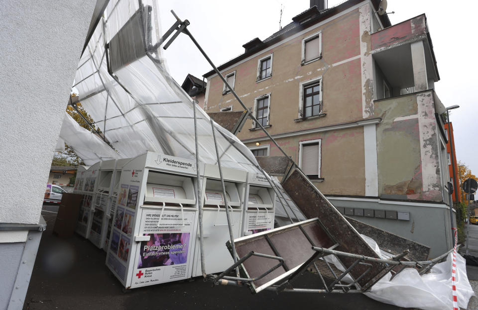 A collapsed scaffold lies in front of a house in Wuerzburg, Germany, Thursday, Oct. 21, 2021. Germany is hit by heavy rain and storms. (Karl-Josef Hildenbrand/dpa via AP)
