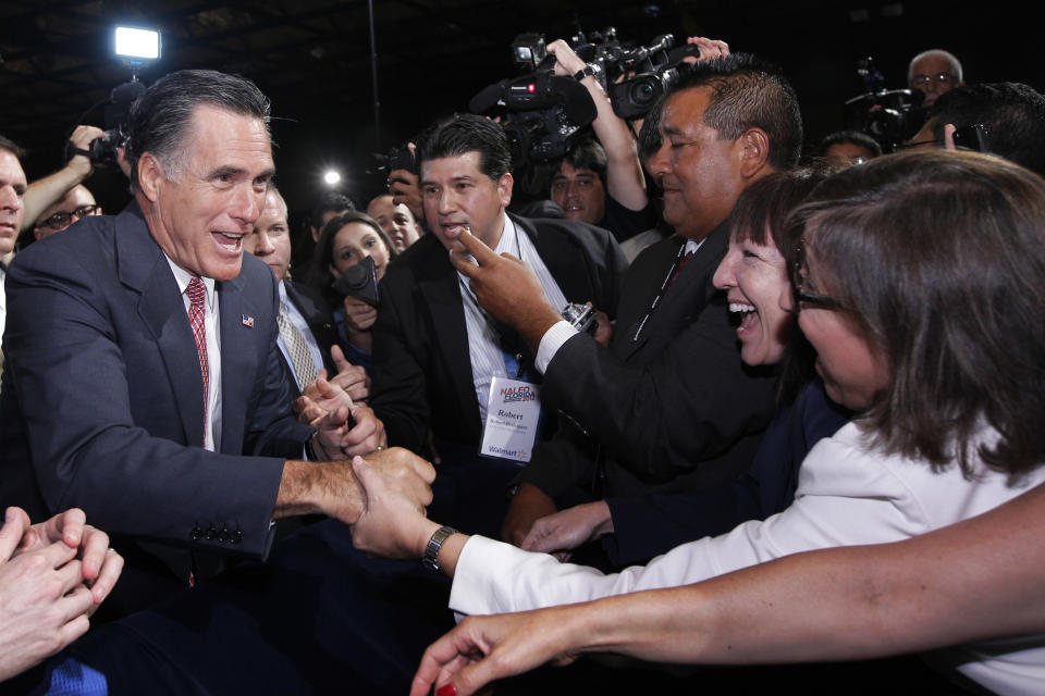 Republican presidential candidate, former Massachusetts Gov. Mitt Romney, greets attendees at the NALEO (National Association of Latino Elected and Appointed Officials) conference in Orlando, Fla., Thursday, June 21, 2012. (AP Photo/Charles Dharapak)