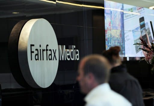 A man walks past signage in the foyer of the Sydney office of Fairfax Media on June 18, 2012. airfax Wednesday said editorial independence was at the core of the company, as mining magnate Gina Rinehart pushes for greater influence at the respected newspaper firm