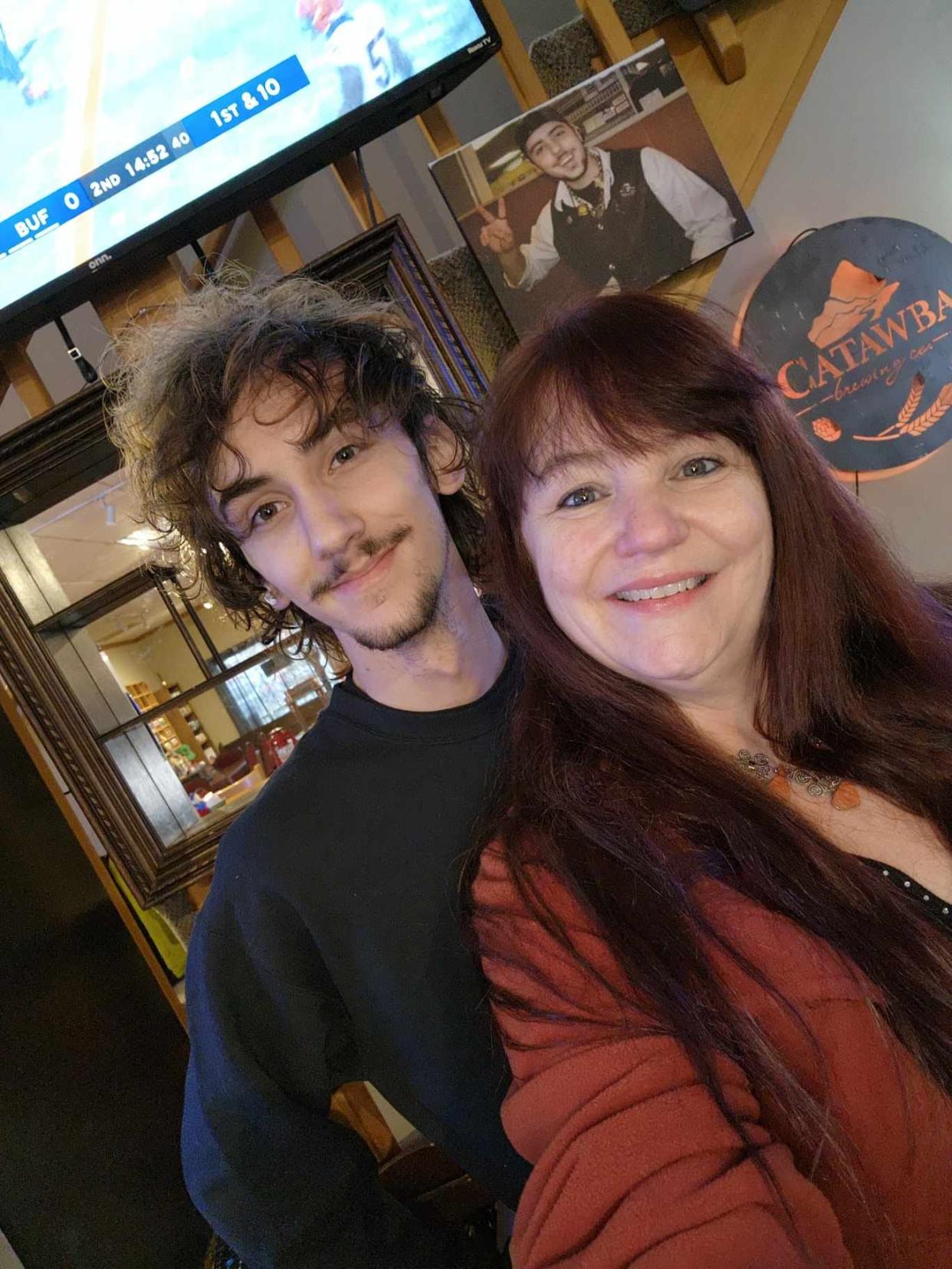 Saluda Whistle Stop Pizza & Wings co-owner Melisa Smith poses with her son Hunter.