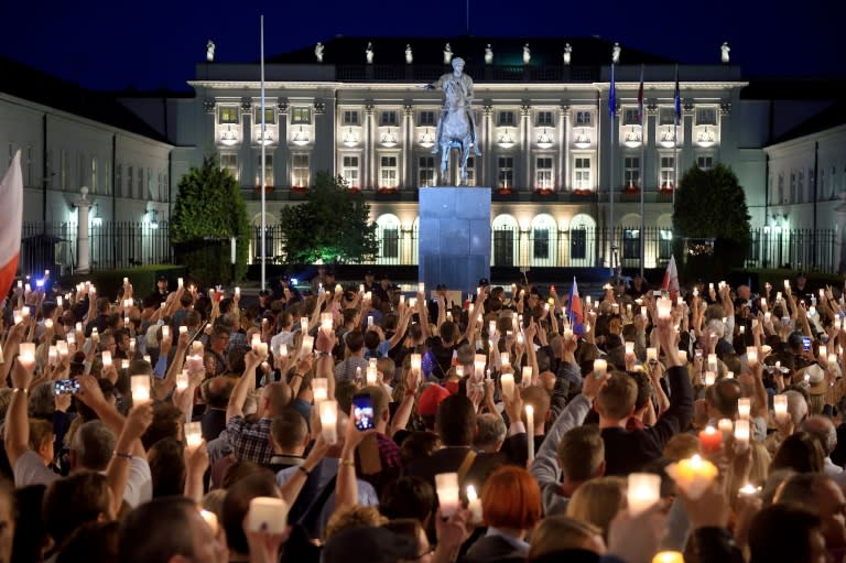 People gather for a protest in front of the presidential palace in Warsaw on July 18, 2017 urging the Polish president to reject a bill changing the judiciary system