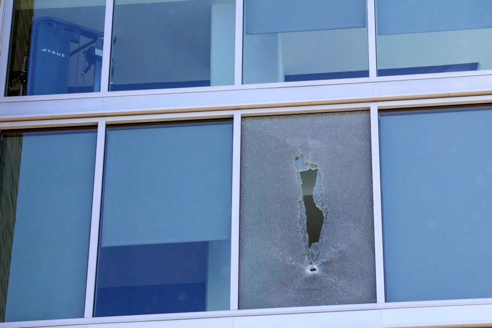 PHOTO: A bullet-shattered window of a dorm room is seen at Thurgood Marshall Hall at Morgan State University on October 04, 2023 in Baltimore, Maryland. (Anna Moneymaker/Getty Images)