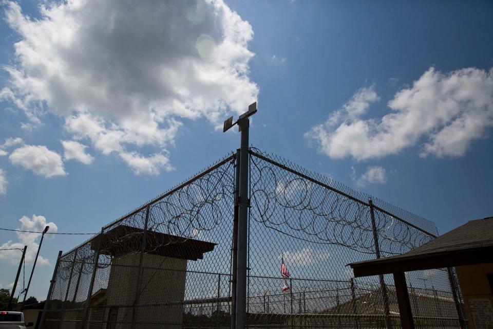 A fence is pictured outside Elmore Correctional Facility in Alabama. Incarcerated people in the state alleged forced starvation and labour during a recent three-week strike. (AP)