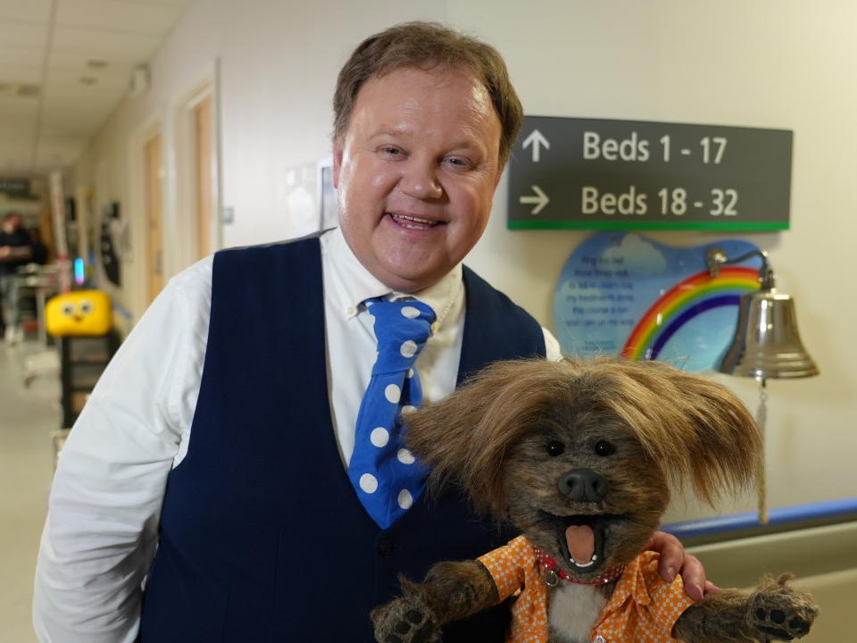 CBeebies presenter Justin Fletcher, accompanied by Dodge the Dog, will read The Hospital Dog at the Royal Manchester Children’s Hospital (BBC/CBeebies/PA)