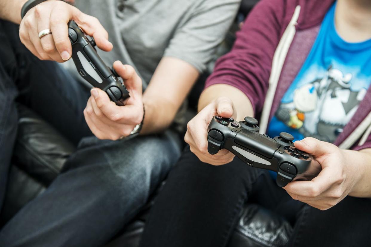 <span class="caption">Playing games can offer an insider's perspective on screen time quality and quantity.</span> <span class="attribution"><a class="link " href="https://www.gettyimages.com/detail/news-photo/detail-of-two-people-holding-sony-playstation-4-video-game-news-photo/1125671862" rel="nofollow noopener" target="_blank" data-ylk="slk:James Sheppard/Future via Getty Images;elm:context_link;itc:0;sec:content-canvas">James Sheppard/Future via Getty Images</a></span>