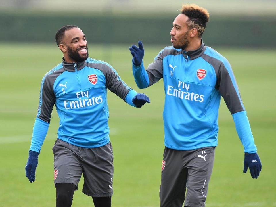 The pair in training at Arsenal: Getty