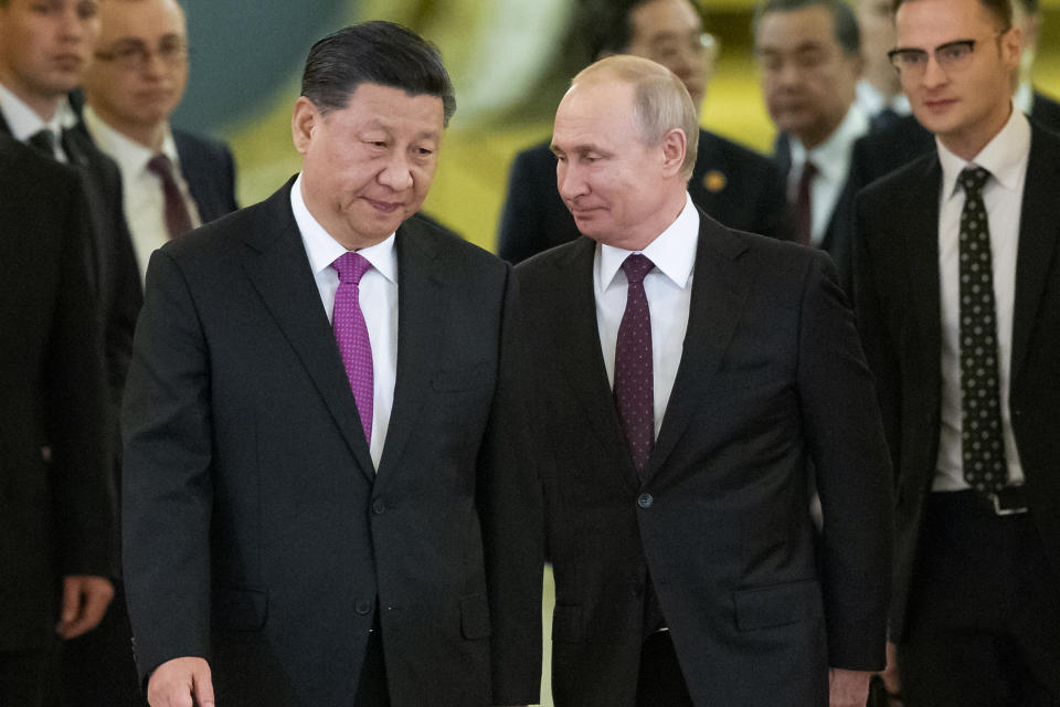 FILE - Chinese President Xi Jinping, center left, and Russian President Vladimir Putin, center right, enter a hall for talks in the Kremlin in Moscow, Russia, June 5, 2019. Russia and China have forged closer military ties with a series of joint war games, and some believe that Moscow could further bolster its cooperation with Beijing amid the tensions with the West over Ukraine. (AP Photo/Alexander Zemlianichenko, Pool, File)