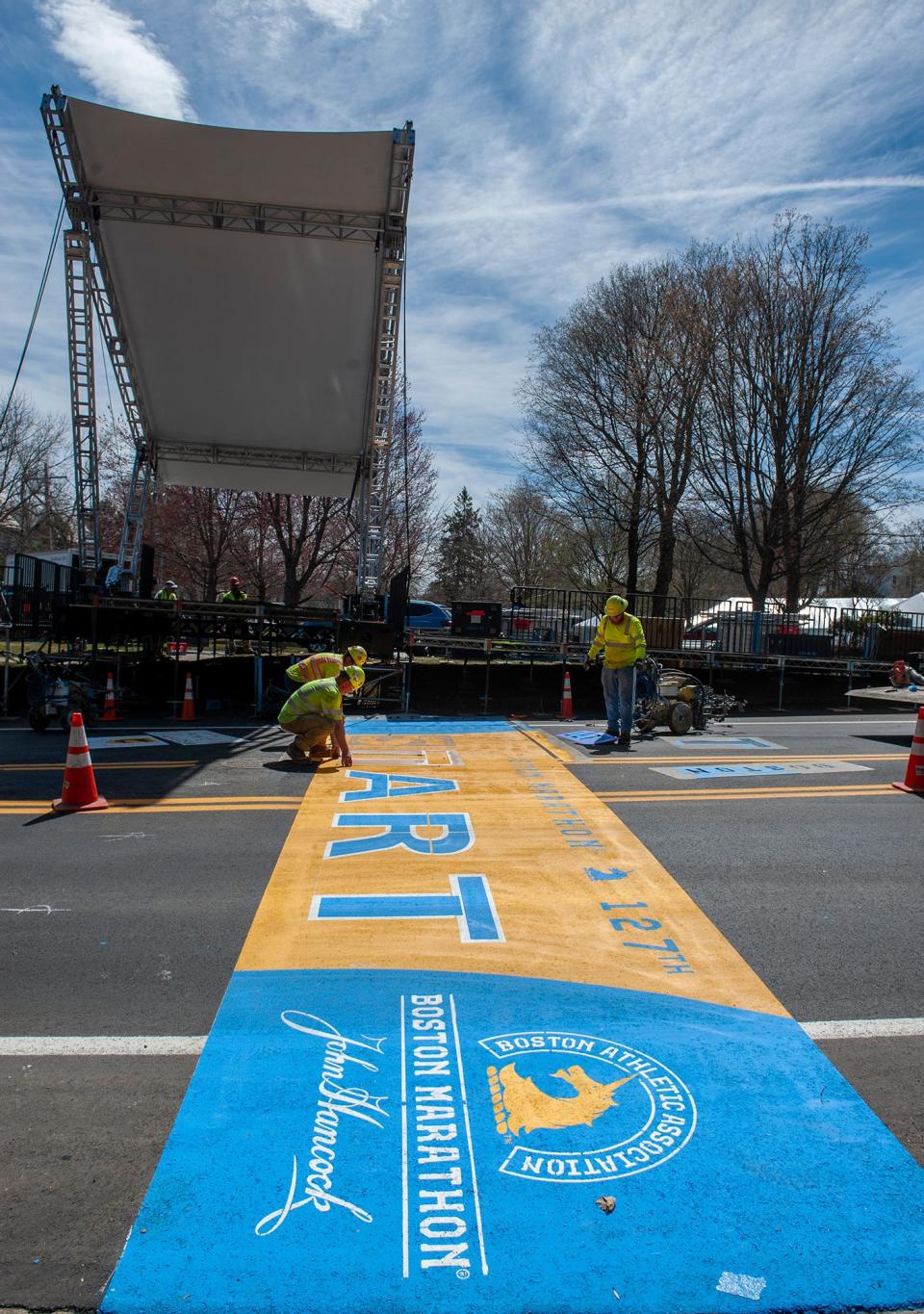 Painting took place Wednesday at the start line for the 127th running of the Boston Marathon on Main Street (Route 135) in Hopkinton, April 11, 2023.