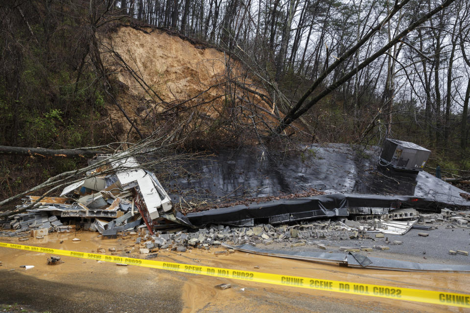 The remains of a Subway restaurant on Signal Mountain Road are seen after an overnight mudslide destroyed the business on Saturday, Feb. 23, 2019, in Chattanooga, Tenn. Subway manager Robbie Anderson said that the restaurant had closed at about 2:00 on Friday for safety after two trees fell from the hillside. (Doug Strickland/Chattanooga Times Free Press via AP)