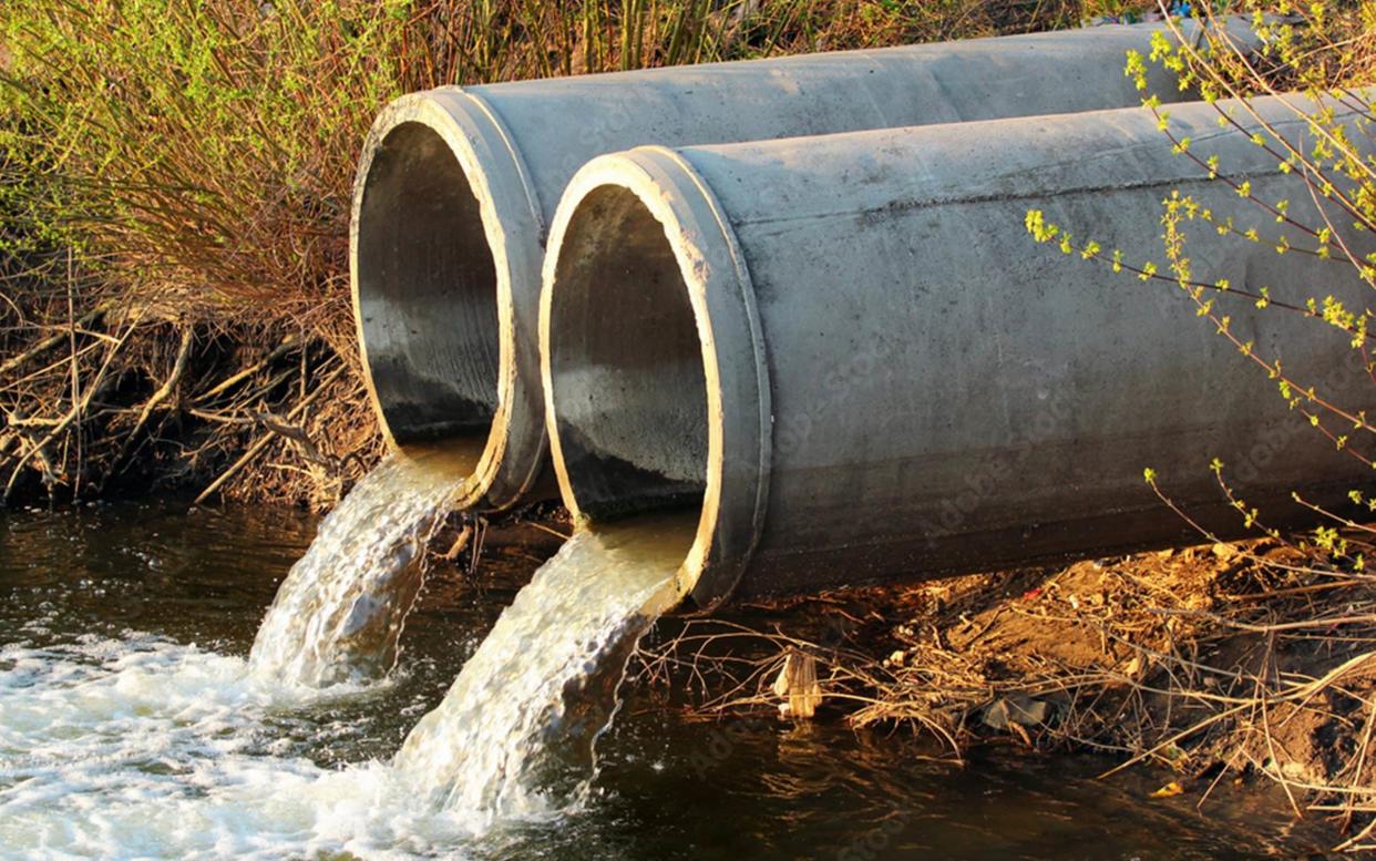 Discharge of sewage into a river