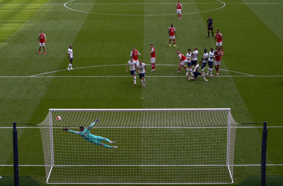 LONDON, ENGLAND - JULY 12: Hugo Lloris of Tottenham Hotspur makes a save during the Premier League match between Tottenham Hotspur and Arsenal FC at Tottenham Hotspur Stadium on July 12, 2020 in London, England. Football Stadiums around Europe remain empty due to the Coronavirus Pandemic as Government social distancing laws prohibit fans inside venues resulting in all fixtures being played behind closed doors. (Photo by Tottenham Hotspur FC/Tottenham Hotspur FC via Getty Images)