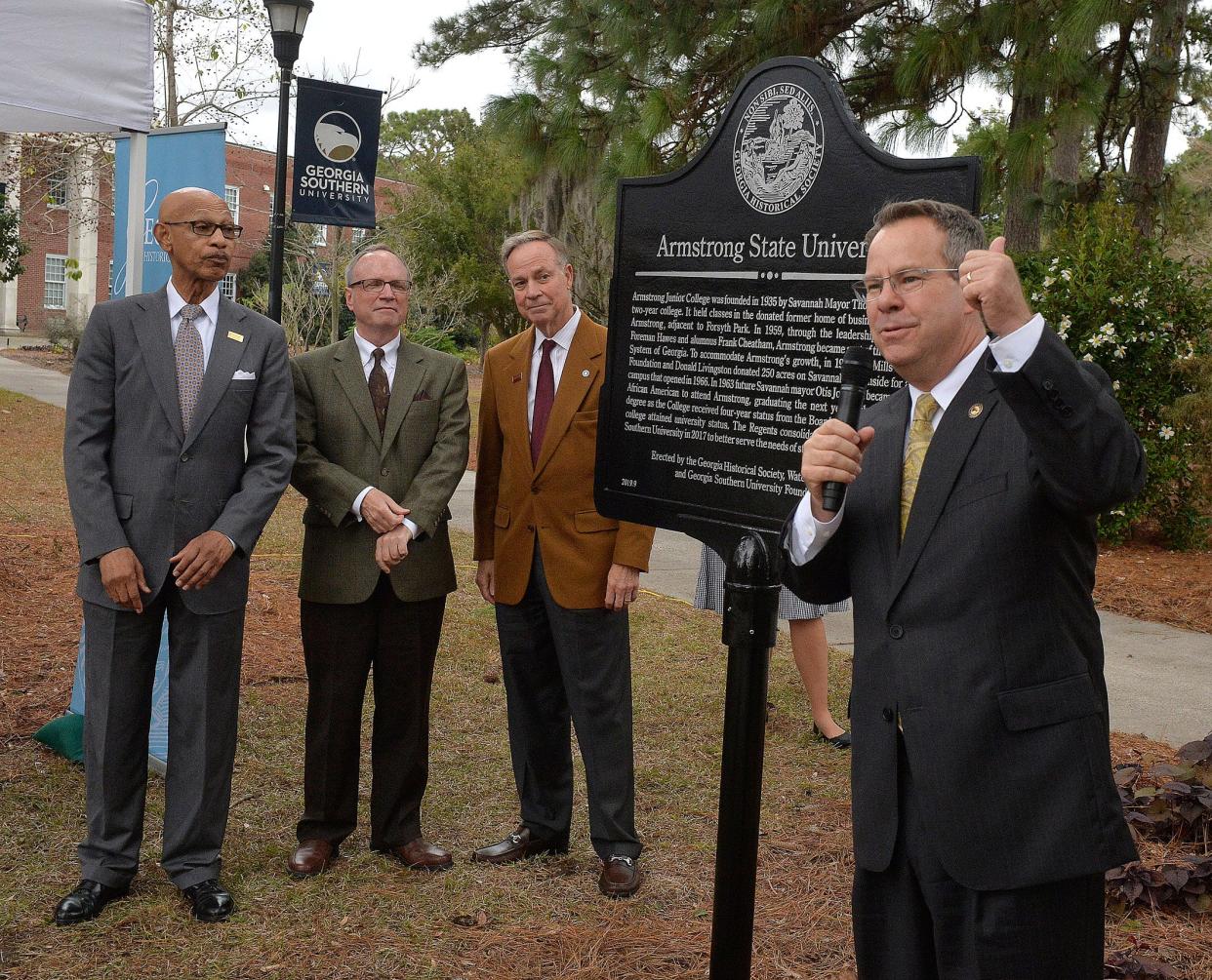 Kyle Marrero, right, president of Georgia Southern University, reads the historical marker that was unveiled Tuesday on the Armstrong Campus. Participating in the unveiling were l-r former Mayor Otis Johnson, W. Todd Groce, President and CEO of the Georgia Historical Society and Don Waters, chairman of the Georgia Board of Regents.   [Steve Bisson/savannahnow.com]