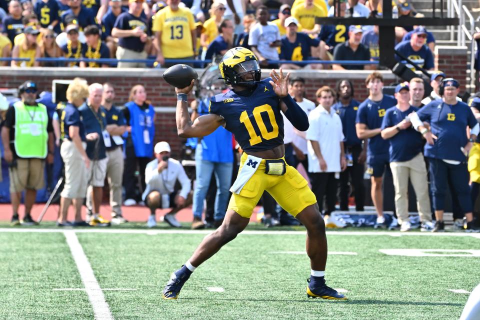 ANN ARBOR, MI - SEPTEMBER 15: Michigan Wolverines quarterback Alex Orji (10) drops back to pass during the Detroit Lions versus the Tampa Bay Buccaneers game on Sunday September 15, 2024 at Ford Field in Detroit, MI. (Photo by Steven King/Icon Sportswire via Getty Images)