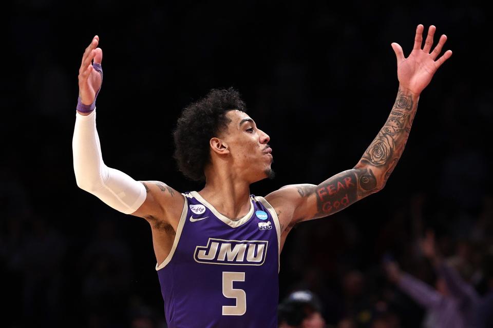 Terrence Edwards Jr. of the James Madison Dukes celebrates after defeating the Wisconsin Badgers, 72-61, in the first round of the NCAA Men's Basketball Tournament at Barclays Center on March 22, 2024, in Brooklyn, New York.