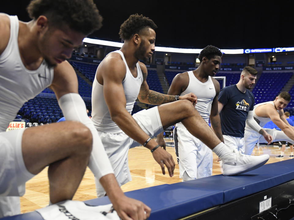 From left to right, Penn State players Seth Lundy, Lamar Stevens, Mike Watkins, Trent Buttrick and John Harrar stretch before an NCAA college basketball game against Central Connecticut State, Friday, Dec. 20, 2019, in State College, Pa. (AP Photo/John Beale)