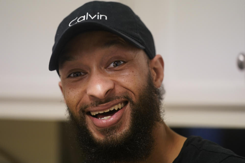 Richard Coleman II poses in his home in Richmond, Va., Thursday, Feb. 11, 2021. Coleman said he was asked to leave four jobs and was taken out of the running for at least six others because of his convictions for possessing a fraction of an ounce of marijuana, once as a college student in 2003 and a second time a few years later. (AP Photo/Steve Helber)