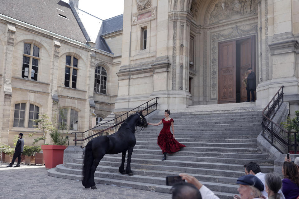 A model wears a creation for Franck Sorbier's Haute Couture Fall/Winter 2022-2023 fashion collection presented Wednesday, July 6, 2022 in Paris. (AP Photo/Lewis Joly)