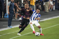 Mexico defenseman Luis Rodriguez, left, and Honduras defenseman Diego Rodriguez compete for the ball during the first half of a CONCACAF Gold Cup soccer match, Saturday, July 24, 2021, in Glendale, Ariz. (AP Photo/Rick Scuteri)