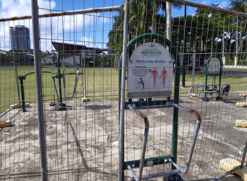 A outdoor exercise area is seen fenced off and closed in Suva, Fiji, Friday, June 25, 2021. A growing coronavirus outbreak in Fiji is stretching the health system and devastating the economy. It has even prompted the government to offer jobless people tools and cash to become farmers.(AP Photo/Aileen Torres-Bennett)