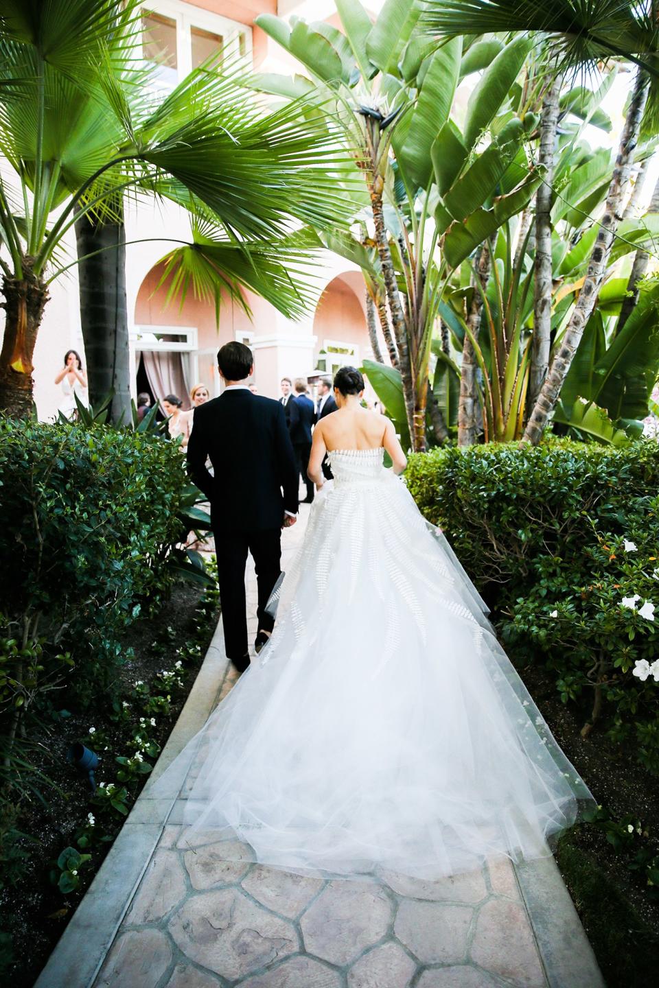 The bride wore Oscar de la Renta, inspired by her grandmother, for her greenery-filled ceremony at the Beverly Hills Hotel.