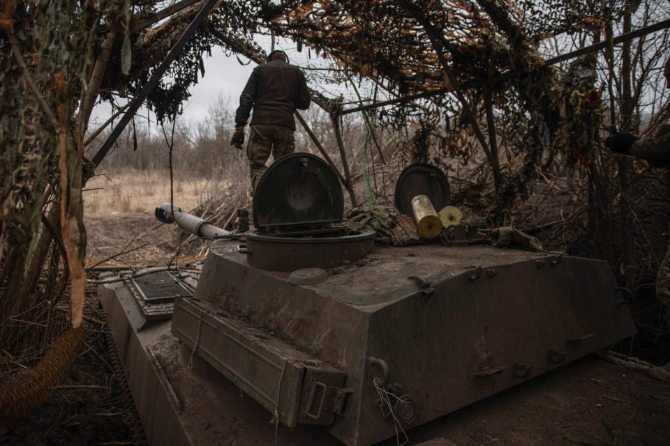 Ukrainian soldiers prepare a self-propelled artillery vehicle to fire towards Russian positions on the front line in the Donetsk region (AP)
