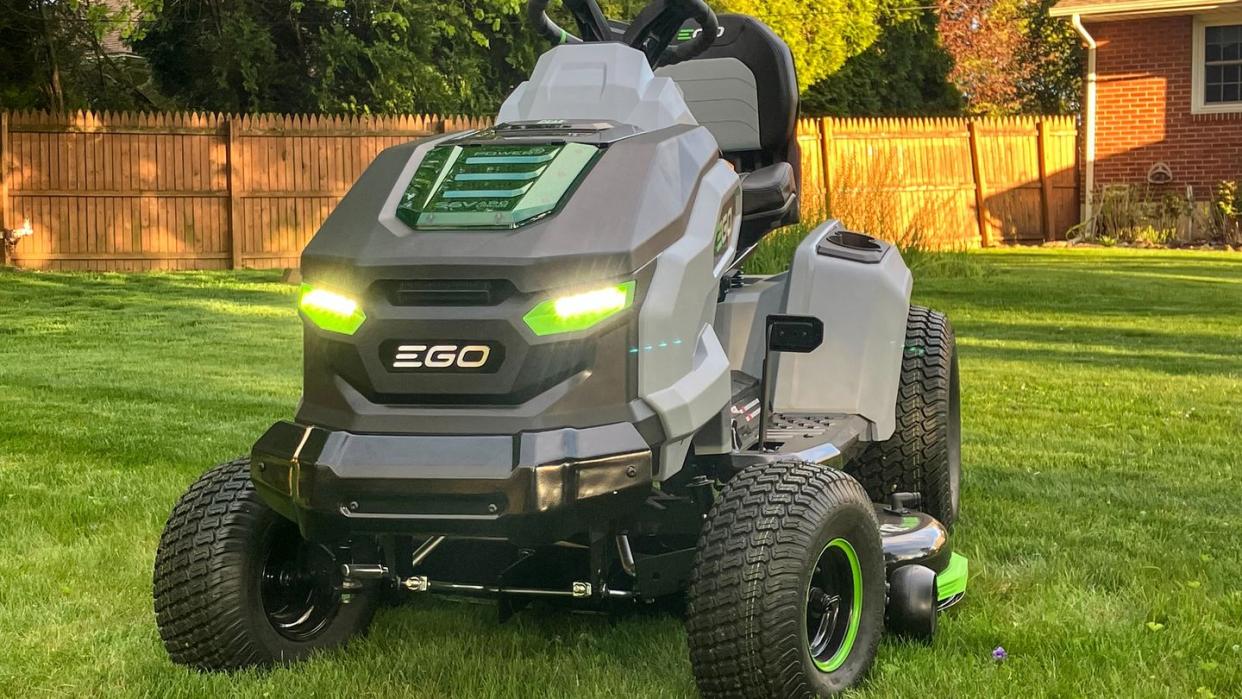 a mower parked in a yard