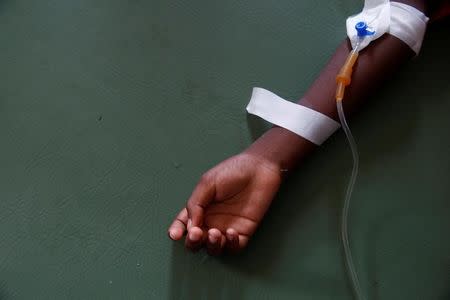 A child is being treated at the cholera treatment center at the hospital after Hurricane Matthew passes in Jeremie, Haiti, October 9, 2016. REUTERS/Carlos Garcia Rawlins