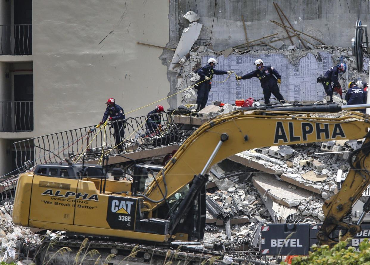 A South Florida Urban Search and Rescue team looks for survivors at the 12-story oceanfront condo, Champlain Towers South, Saturday, June 26, 2021.