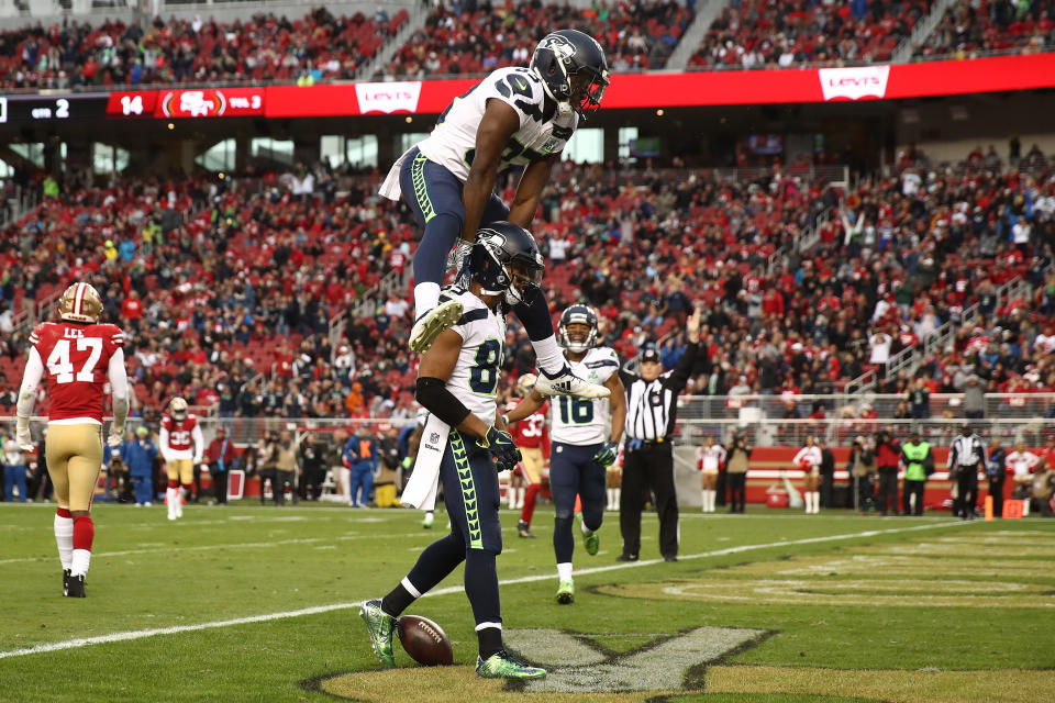 <p>Doug Baldwin #89 of the Seattle Seahawks vaulted by David Moore #83 after scoring a touchdown against the San Francisco 49ers during their NFL game at Levi’s Stadium on December 16, 2018 in Santa Clara, California. (Photo by Ezra Shaw/Getty Images) </p>