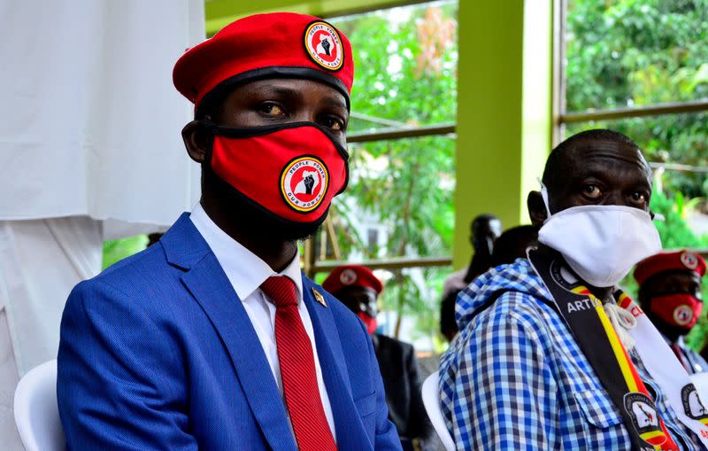 FILE PHOTO: FILE PHOTO: Ugandan musician turned politician, Robert Kyagulanyi also known as Bobi Wine and Uganda's four time Presidential candidate Kizza Besigye attend a joint news conference in Kampala