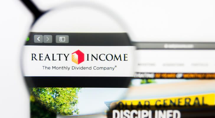 realty income (O) logo highlighted by a magnifying glass on a web browser