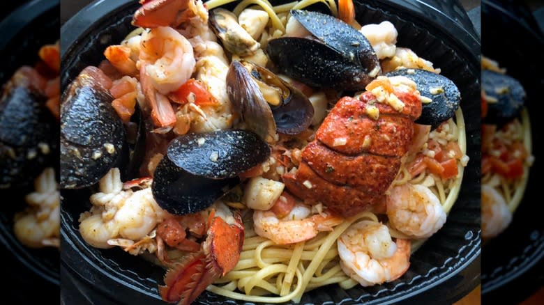 various shellfish over linguini