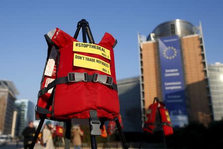 Lifejackets are pictured in front of the European Commission headquarters during a protest by Amnesty International in Brussels, Belgium, March 17, 2016. REUTERS/Francois Lenoir