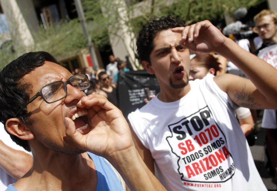Demonstrators protest against Arizona's controversial Senate Bill 1070 immigration law outside Sheriff Joe Arpaio's office in Phoenix on July 29, 2010.