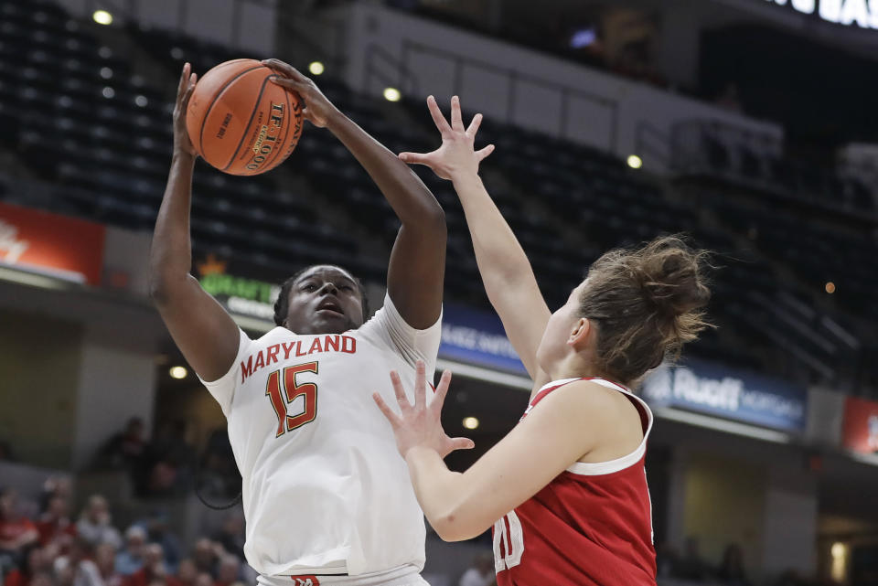 Maryland's Ashley Owusu (15) grabs a rebound against Indiana's Aleksa Gulbe (10) during the second half of an NCAA college basketball semifinal game at the Big Ten Conference tournament, Saturday, March 7, 2020, in Indianapolis. Maryland won 66-51. (AP Photo/Darron Cummings)