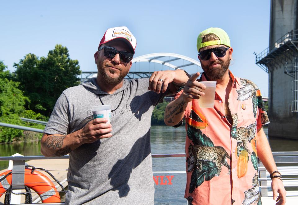 Locash, the Nashville duo, Chris and Preston celebrate their hit single, "beach boys" on a boat at the Cumberland River in Nashville, Tenn., Tuesday, June 21, 2022. 