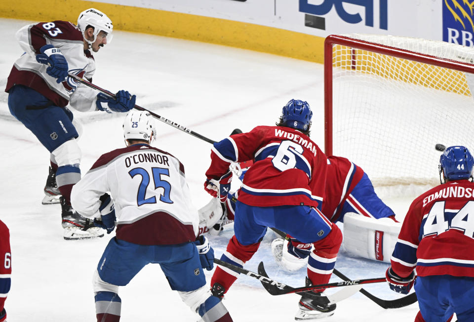 Colorado Avalanche's Matt Nieto scores against Montreal Canadiens goaltender Jake Allen during the first period of an NHL hockey game in Montreal, Monday, March 13, 2023. (Graham Hughes/The Canadian Press via AP)