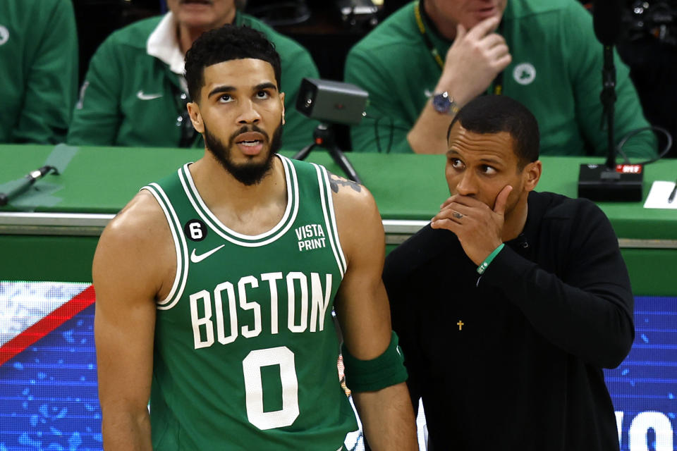 Boston Celtics head coach Joe Mazzulla, right, talks with forward Jayson Tatum during the first half in Game 5 of an NBA basketball Eastern Conference Final series against the Miami Heat Thursday, May 25, 2023, in Boston. (AP Photo/Michael Dwyer)