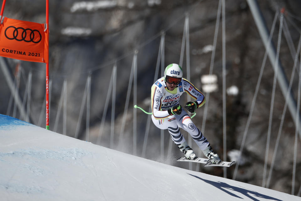 Germany's Dominik Schwaiger speeds down the course during the men's downhill, at the alpine ski World Championships in Cortina d'Ampezzo, Italy, Sunday, Feb.14, 2021. (AP Photo/Gabriele Facciotti)