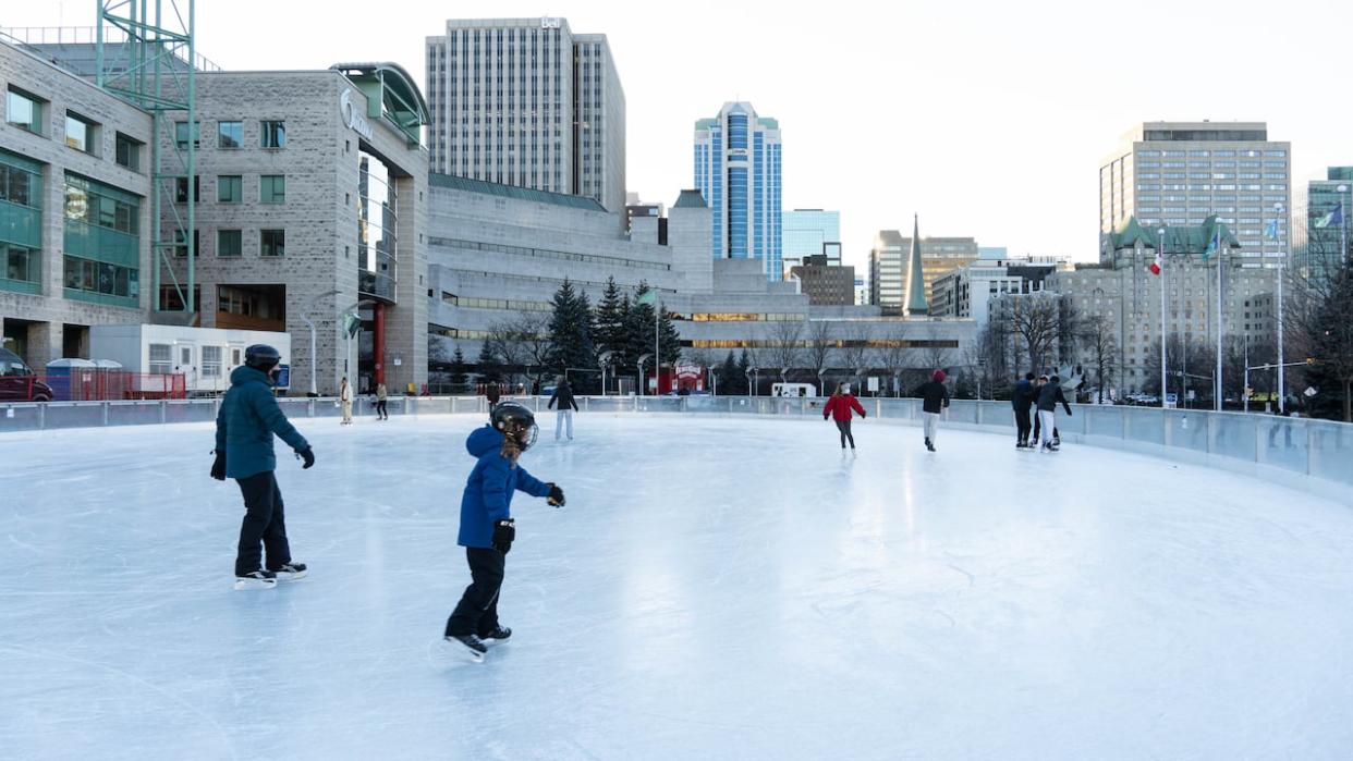 Skaters glide on the Rink of Dreams outside Ottawa City Hall in 2021. The rink is slated to be open on Family Day, weather permitting. (Jean Delisle/CBC - image credit)