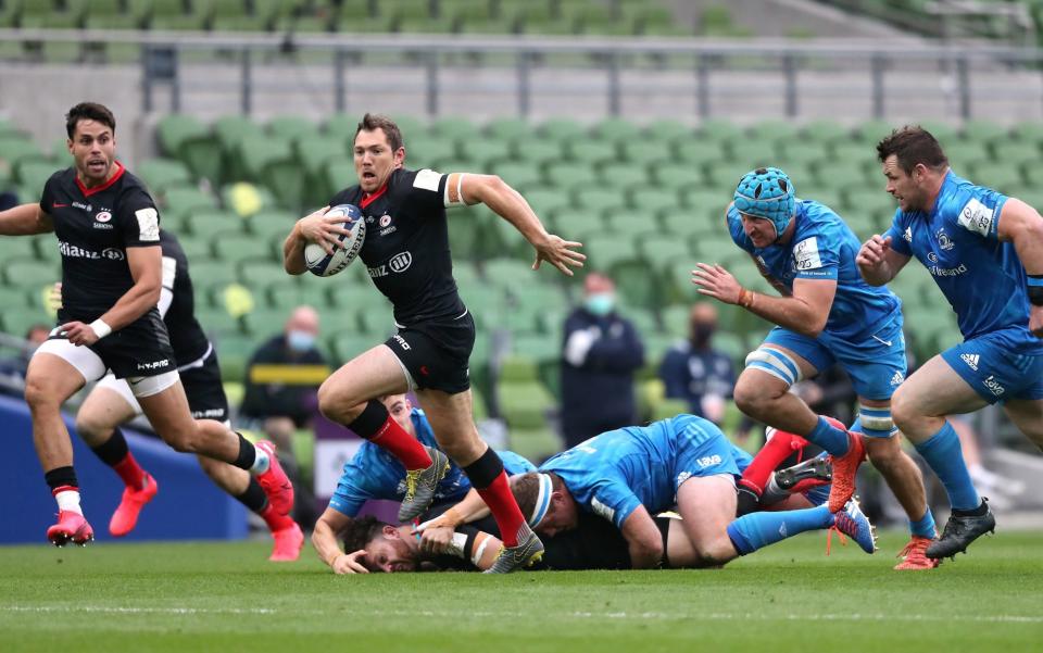 Saracens' Alex Goode (centre) on his way to scoring his side's first try of the game during the European Champions Cup quarter final match at the Aviva Stadium, Dublin.  - PA