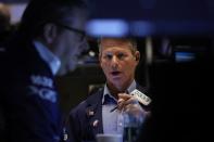 Traders work on the floor of the NYSE in New York