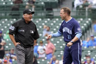 CORRECTS UMPIRE NAME TO TOM HALLION, NOT PHIL CUZZI - Chicago Cubs bench coach Andy Green, right, argues with umpire Tom Hallion after Hallion ejected Green during the sixth inning of a baseball game Friday, Sept. 3, 2021, in Chicago. Green took the helm of the team since manager David Ross and president of baseball operations Jed Hoyer have tested positive for COVID-19. (AP Photo/Charles Rex Arbogast)