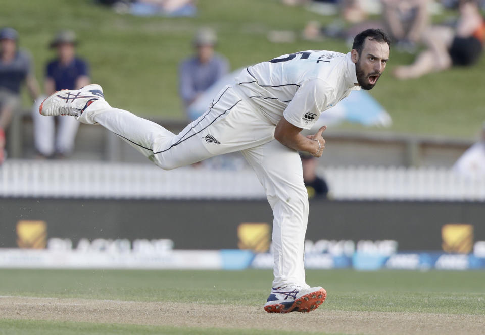 FILE - In this Nov. 30, 2019 file photo,New Zealand's Daryl Mitchell bowls during play on day two of the second cricket test between England and New Zealand at Seddon Park in Hamilton, New Zealand. Mitchell have been included for the first time on New Zealand Cricket's list of centrally contracted players. (AP Photo/Mark Baker,File)