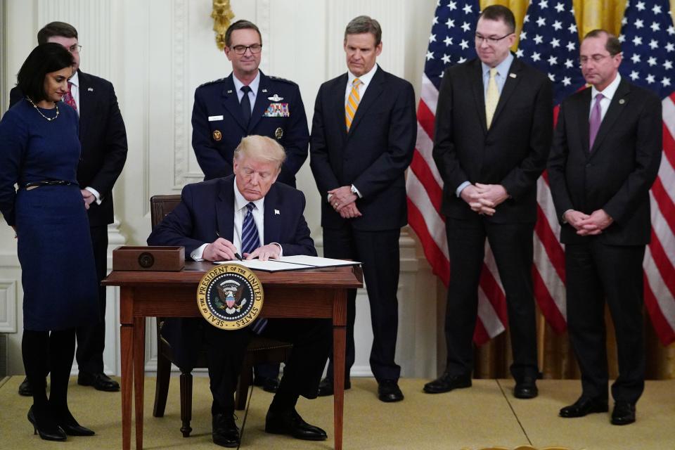 (L-R) Administrator of the Centers for Medicare and Medicaid Services Seema Verma, US Secretary of Veterans Affairs Robert Wilkie, General Joseph Lengyel, Tennessee Governor Bill Lee, FEMA Administrator Peter Gaynor and US Secretary of Health and Human Services Alex Azar watch US President Donald Trump sign a proclamation for Older Americans Month during an event on protecting Americas seniors from the COVID-19 pandemic in the East Room of the White House in Washington, DC on April 30, 2020. (Photo by MANDEL NGAN / AFP) (Photo by MANDEL NGAN/AFP via Getty Images)