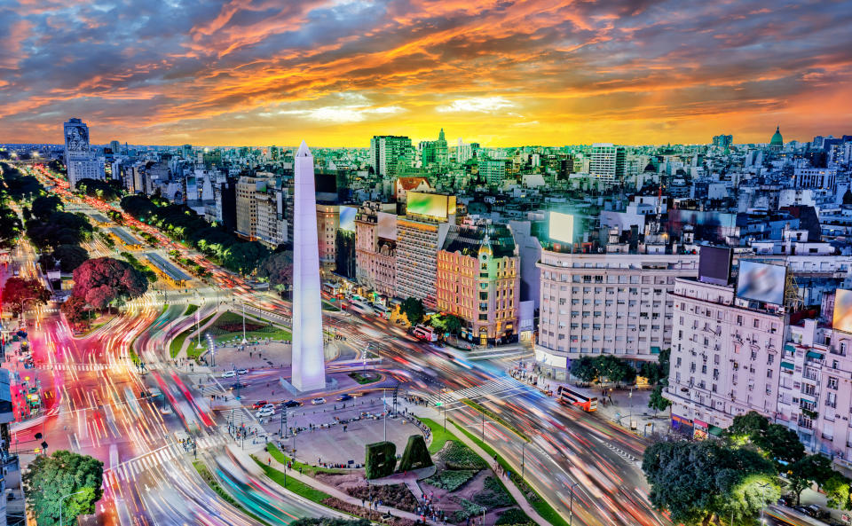 Downtown Buenos Aires, Argentina with traffic at night around the Obelisco. 