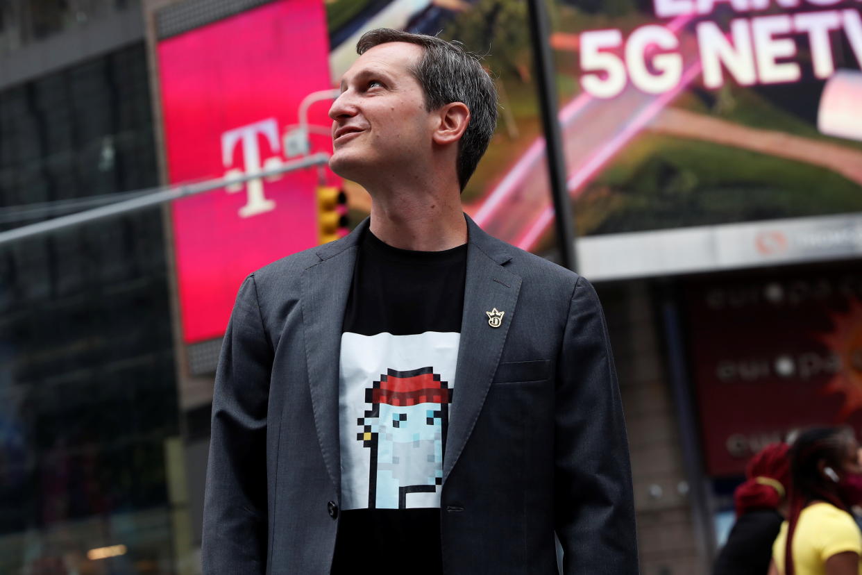 Jason Robins, CEO of DraftKings, reacts after the company's initial public offering (IPO) listing, outside the Nasdaq MarketSite, in New York City, U.S., June 11, 2021. REUTERS/Shannon Stapleton