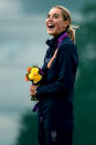 LONDON, ENGLAND - AUGUST 04: Gold medalist Jessica Rossi of Italy signs her national anthem on the podium during the medal ceremony for the Women's Trap Shooting Finals on Day 8 of the London 2012 Olympic Game at the Royal Artillery Barracks on August 4, 2012 in London, England. (Photo by Lars Baron/Getty Images)