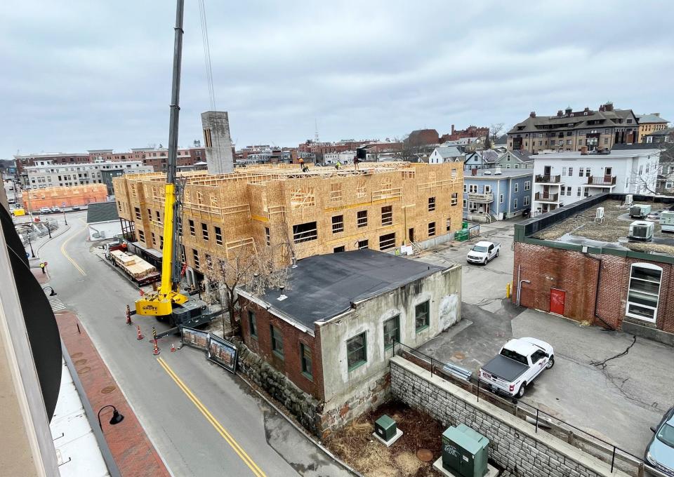 Work continues Monday at the Residence at Foundry Place in Portsmouth, a condo project located adjacent to the city's Foundry Place Parking Garage.