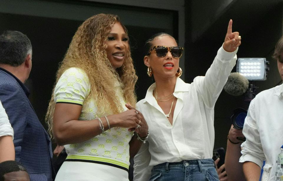 TOPSHOT - Former US professional tennis player Serena Williams (L) and US musician Alicia Keys (R) watch Russia's Andrey Rublev and Bulgaria's Grigor Dimitrov during their men's singles round of 16 match on day seven of the US Open tennis tournament at the USTA Billie Jean King National Tennis Center in New York City, on September 1, 2024. (Photo by TIMOTHY A. CLARY / AFP) (Photo by TIMOTHY A. CLARY/AFP via Getty Images) ORG XMIT: 776152832 ORIG FILE ID: 2169164178